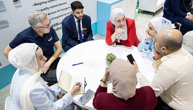Attendees networking at roundtable