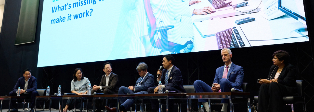 Conference speakers on the stage