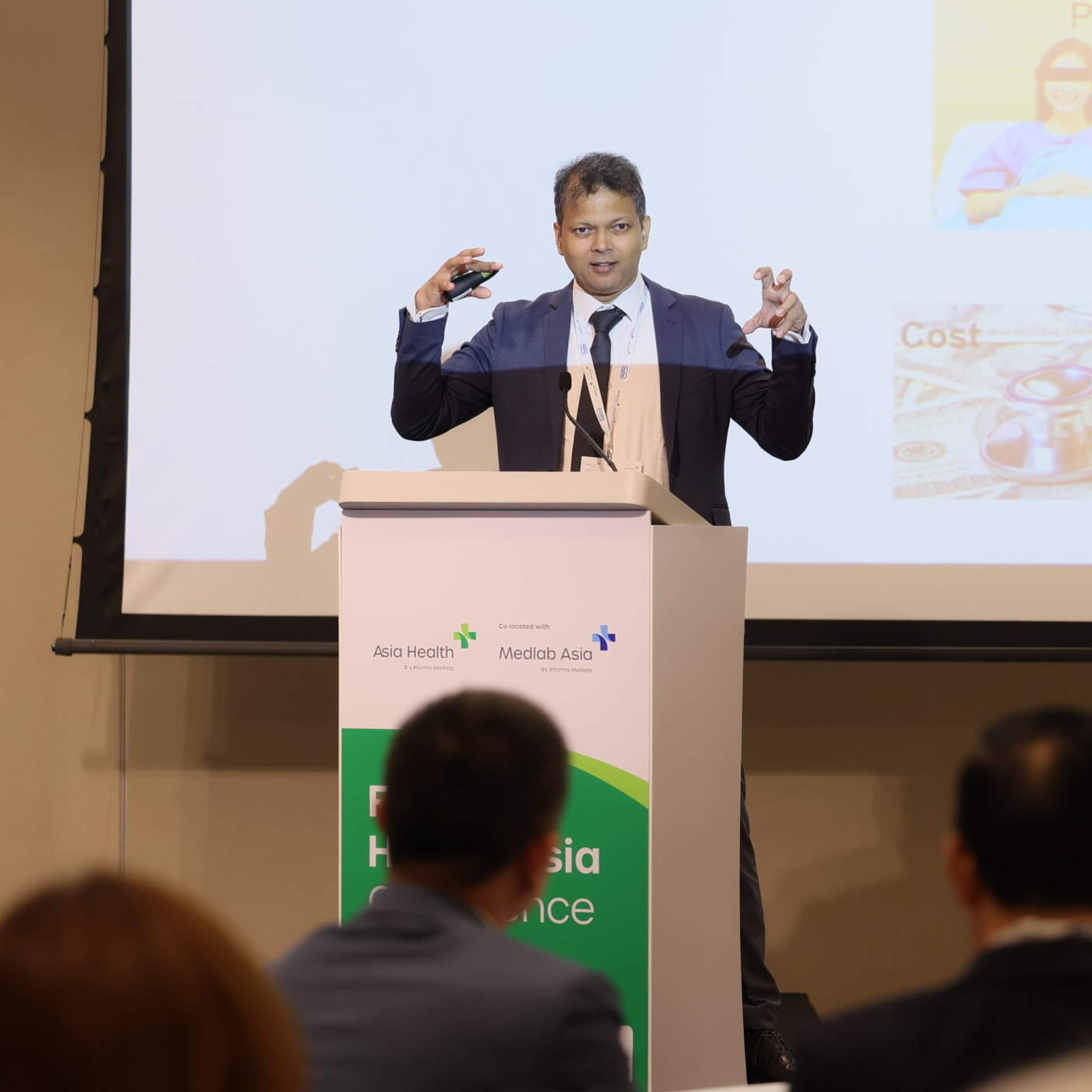 Speaker at a podium at World Health Expo Kuala Lumpur