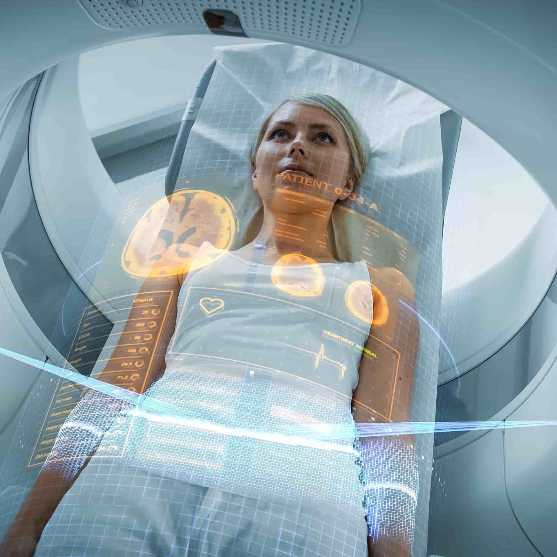 Woman going into a scanner