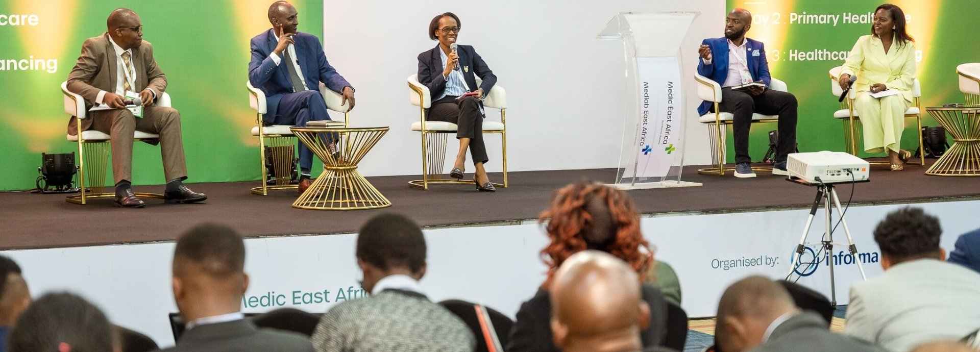 Speakers on stage at a conference at World Health Expo Nairobi