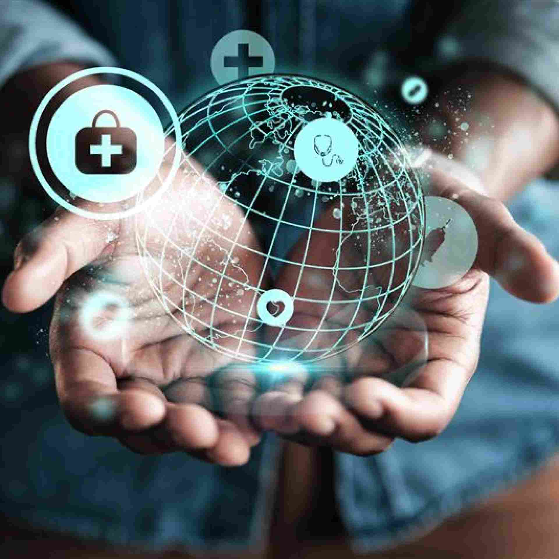Virtual globe in a hand with healthcare symbols