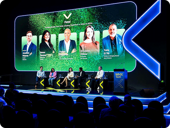 Female speaking on WHX stage