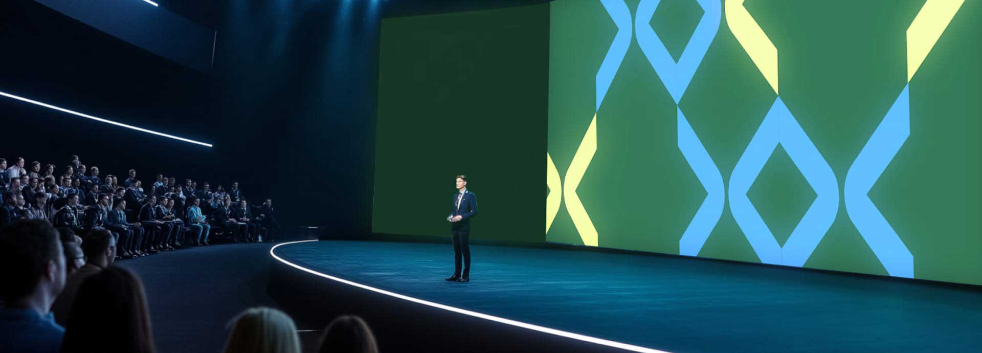 Image of a speaker on stage with WHX branding