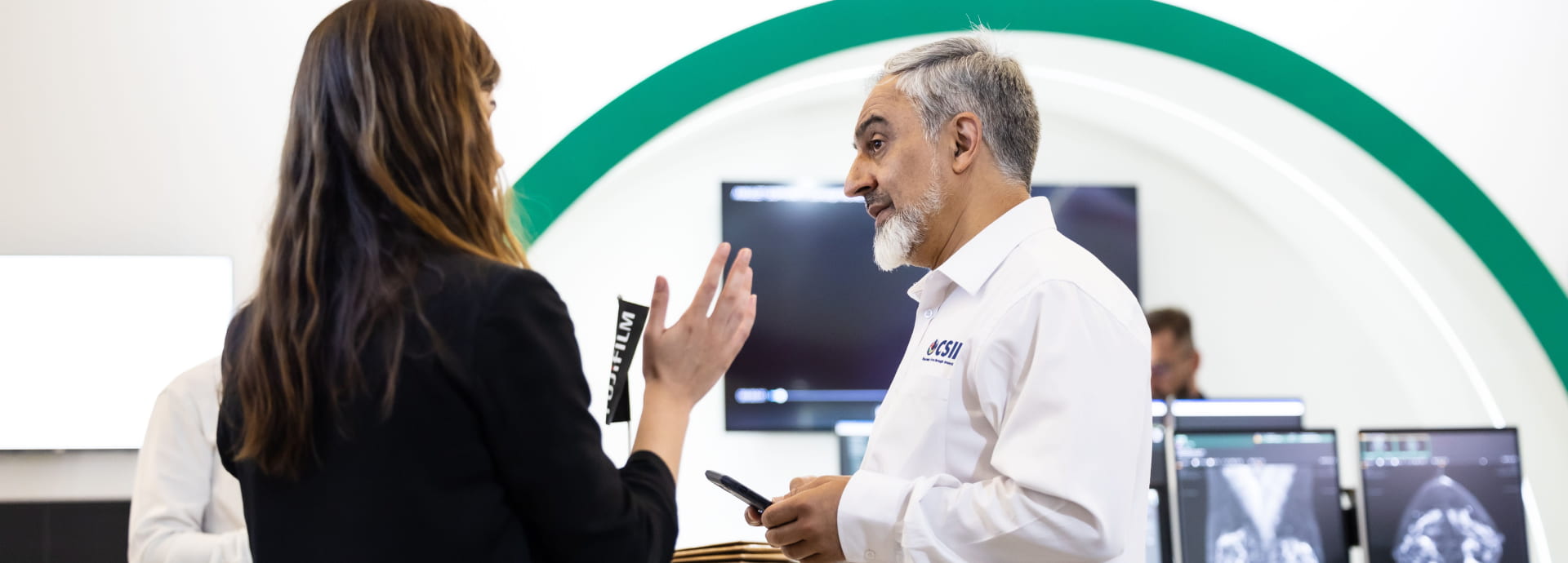 Delegate and exhibitor talking at World Health Expo Labs Cape Town