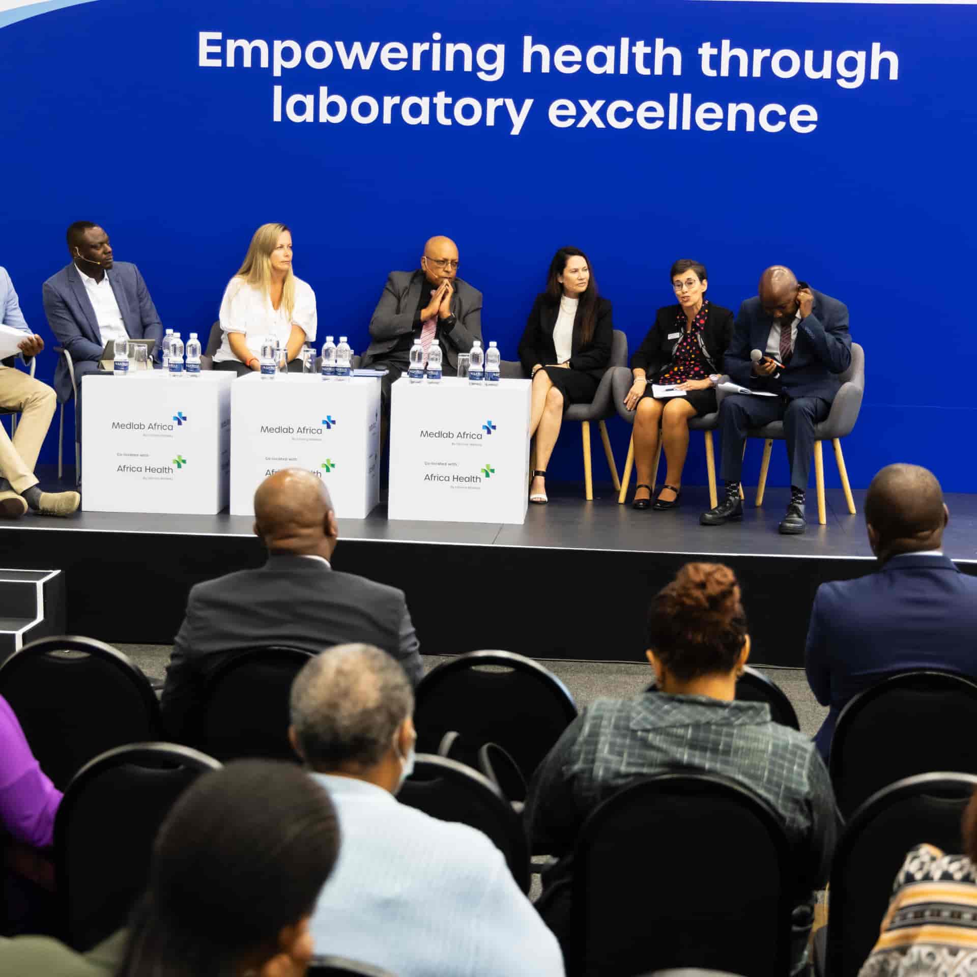Speakers on stage at World Health Expo Labs Cape Town.