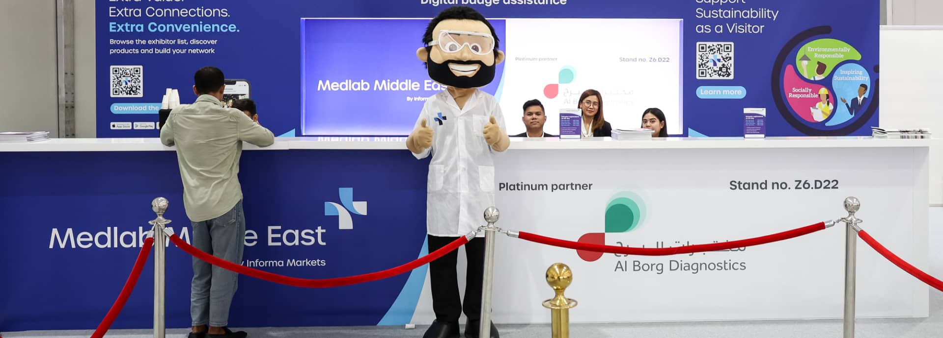 Event Mascot Mr. Meddy at an information desk