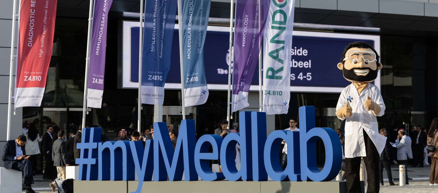 #myMedlab sign at the entrance to World Health Expo Labs Dubai 2025 with the event mascot
