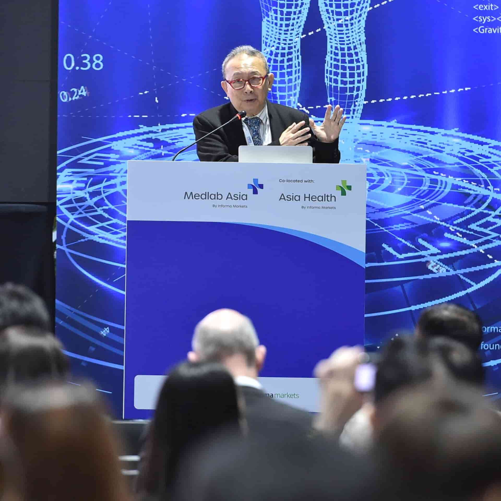 Speaker at the podium at World Health Expo Labs Kuala Lumpur