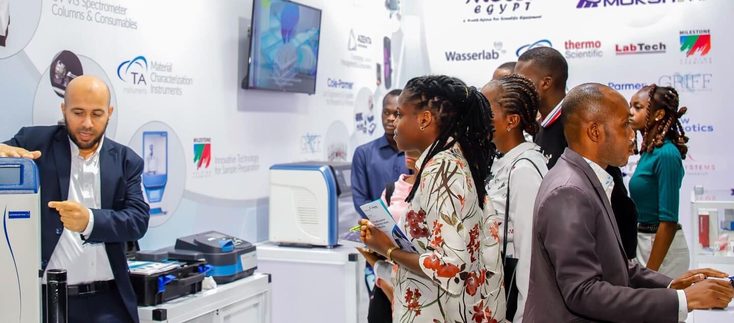 Visitors getting a demonstration of new lab equipment at WHX Lab Lagos