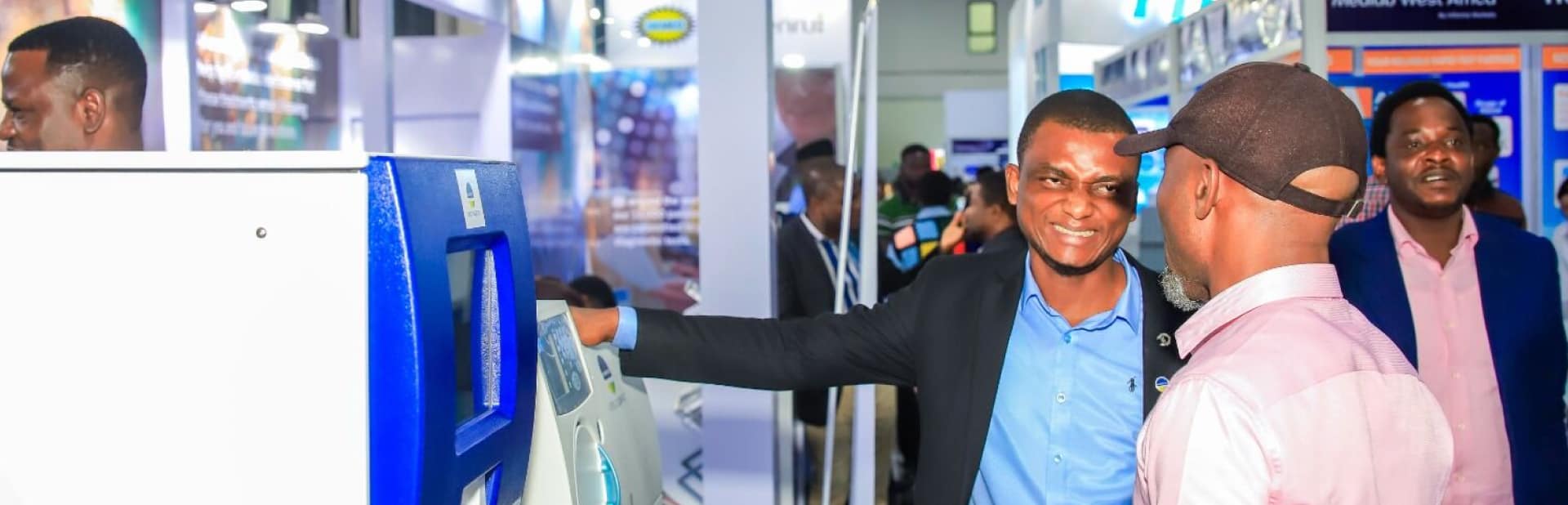 Exhibitor and visitor looking at a product at WHX Labs Lagos
