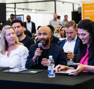 Judge with a microphone at World Health Expo Cape Town.