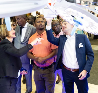 Delegates looking at a product at World Health Expo Cape Town.