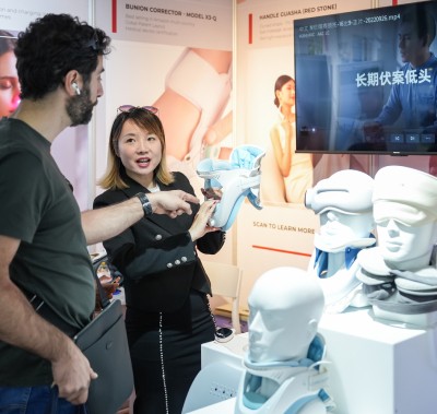 Two people inspecting a medical device at WHX Dubai