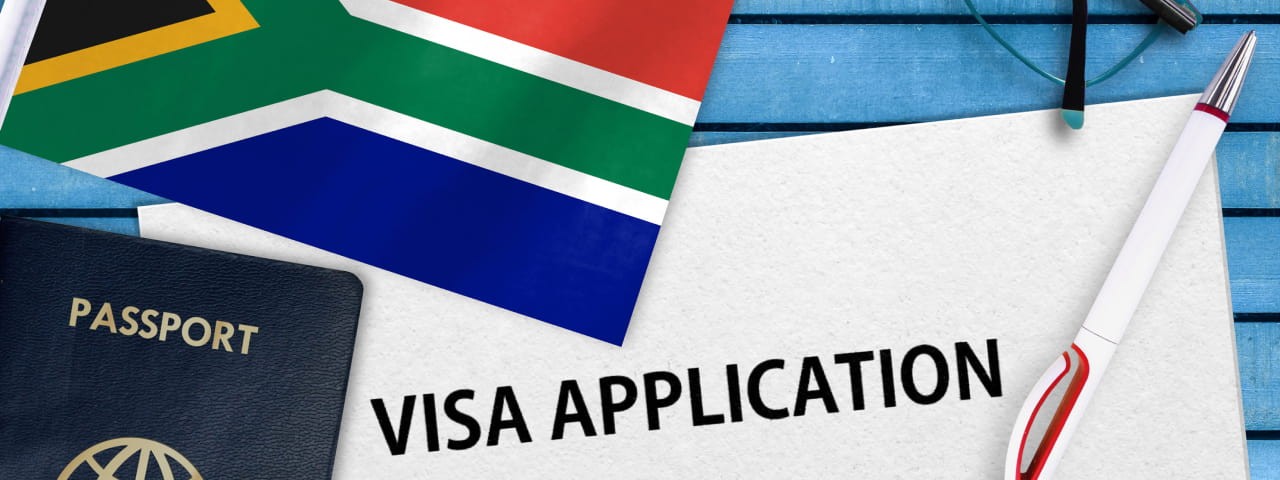 Visa application form with a South African flag and a passport.