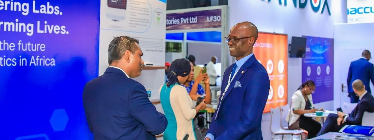 Exhibitor and visitor talking at WHX Lagos