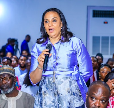 Conference attendee asking a question at WHX Lagos