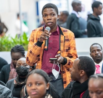 Delegate asking a question at conference in World Health Expo Nairobi