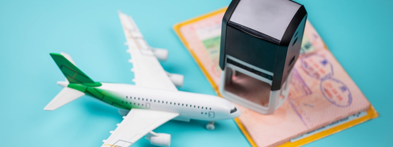 Model plane with a passport and a stamper.