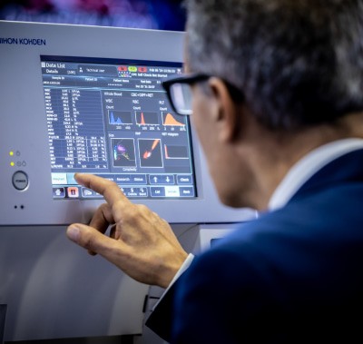 Exhibitor demonstrating a lab monitor at World Health Expo Labs Dubai